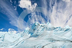 Climbers walk up on glacier in Patagonia.