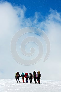 Climbers in winter mountains