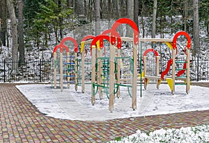 Climbimg frame on winter playground photo