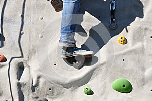 Climbing a boulder wall
