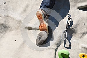 Climbing a boulder wall