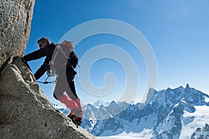 Climbing in Chamonix. Climber on the stone wall of Aiguille du M