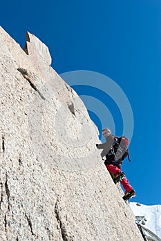 Climbing in Chamonix. Climber on the stone wall of Aiguille du M