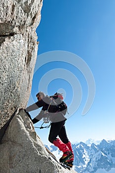 Climbing in Chamonix. Climber on the stone wall of Aiguille du M