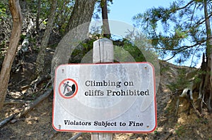 Climbing on cliffs prohibited sign violators subject to fine