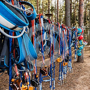 Climbing equipment: ropes with carabiners, safety belts, helmets