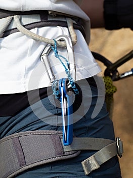 climbing gear in the climber's harness. carabiners and knife to cut the rope in a emergency