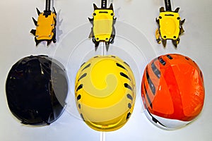 Climbing helmets and crampons on a gray background in a flat lay