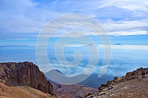 Climbing the Iztaccihuatl volcano, Popocatepetl volcano in Mexico, Tourist on the peak of high rocks. Sport and active life