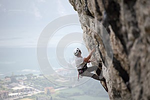 Climbing man on a stone wall