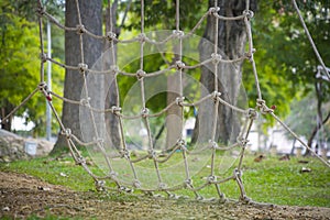 climbing a net Close up climb net rop select focus green nature background