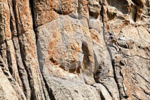 Climbing a rock wall at City of Rocks National reserve.