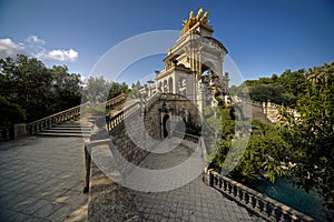 Climbing stairs in a park towards his monument