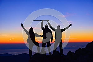 Climbing team on mountaintop