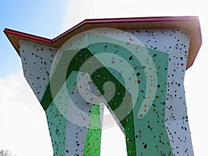 Climbing tower outside modern structure