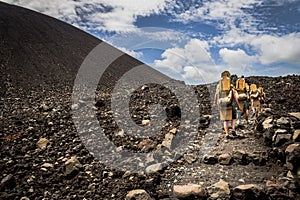 Climbing Up Cerro Negro Volcano to go Sandboarding