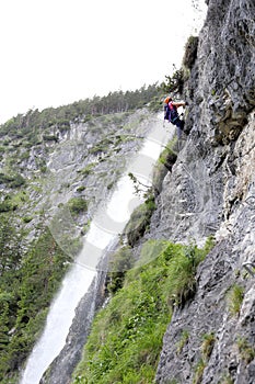 Climbing up near a waterfall