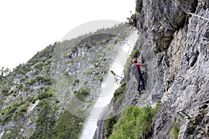 Climbing woman on a rock wall