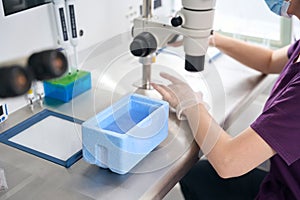 Clinic employee prepares a biomaterial for vitrification