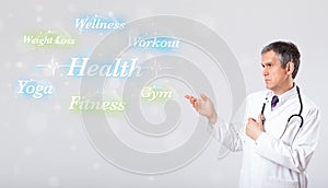 Clinical doctor pointing to health and fitness collection of words