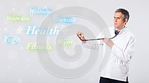 Clinical doctor pointing to health and fitness collection of words