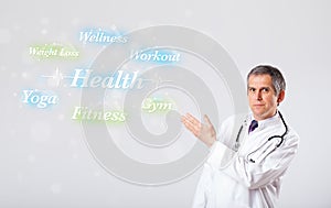 Clinical doctor pointing to health and fitness collection of words