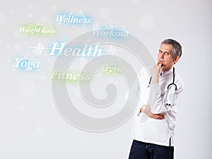 Clinical doctor pointing to health and fitness collection of words