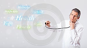 Clinical doctor pointing to health and fitness collection of words