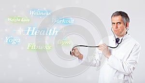 Clinical doctor pointing to health and fitness collection of words