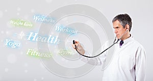 Clinical doctor pointing to health and fitness collection of words