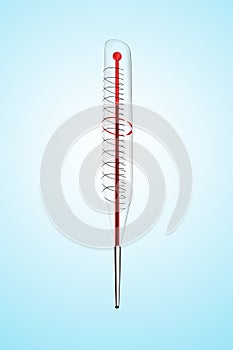 A clinical thermometer against blue backgraound