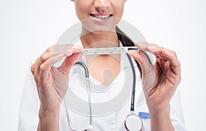 Clinical thermometer in doctor's hands