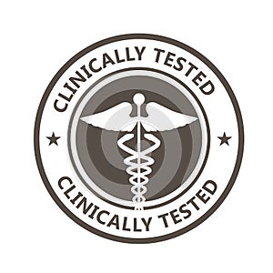 Clinically tested stamp with caduceus - clinically proven medicine photo