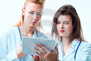 Clinicians review data on tablet