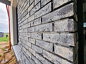 Clinker bricks on the house wall close up