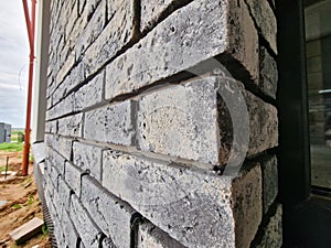 Clinker bricks on the house wall close up