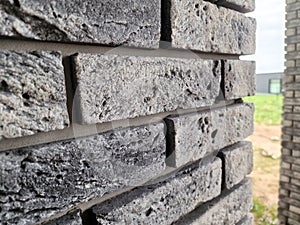 Clinker bricks on the house wall close up