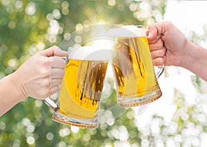 Clinking Beer glasses .