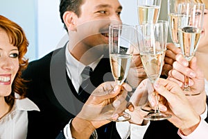Clinking champagne glasses