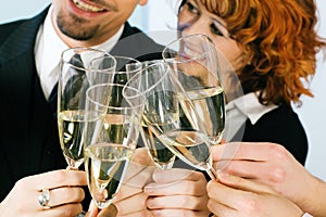 Clinking champagne glasses