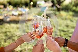 Clinking wine glasses outdoors