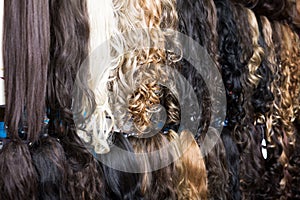 Clip-in hair extensions in wig shop