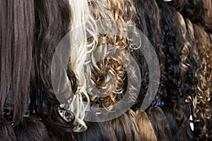 Clip-in hair extensions in wig shop photo