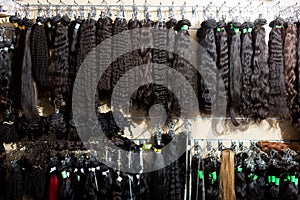 Clip-in hair extensions in wig shop photo