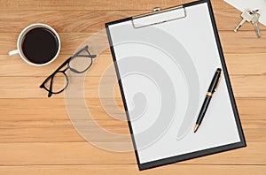 Clipboard with blank recycle paper, pen ,eyeglasses and coffee c