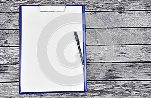 Clipboard with blank white paper with pen