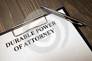 Clipboard with durable power of attorney and pen on desk photo