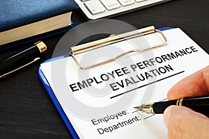 Clipboard with employee performance evaluation.