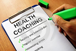 Clipboard with health coaching list. photo