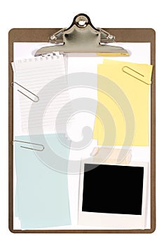 Clipboard with polaroid photo frame, torn notepaper and various post-it style sticky notes